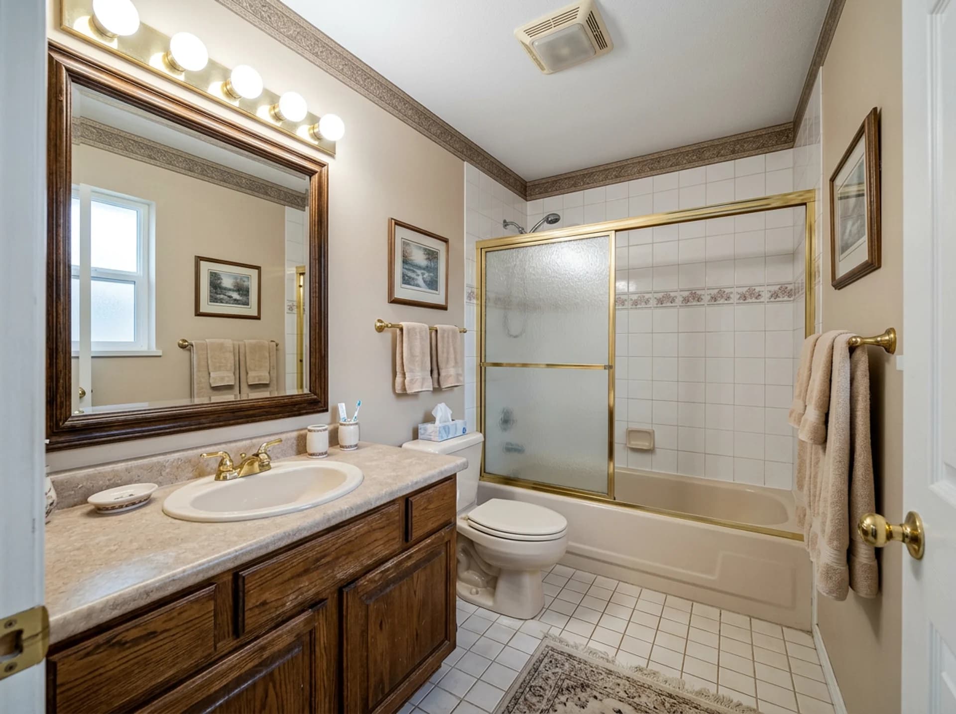 The original dated guest bathroom before remodeling.